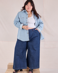 Ashley is wearing Denim Overshirt in Light Wash and dark wash Wide Leg Trousers