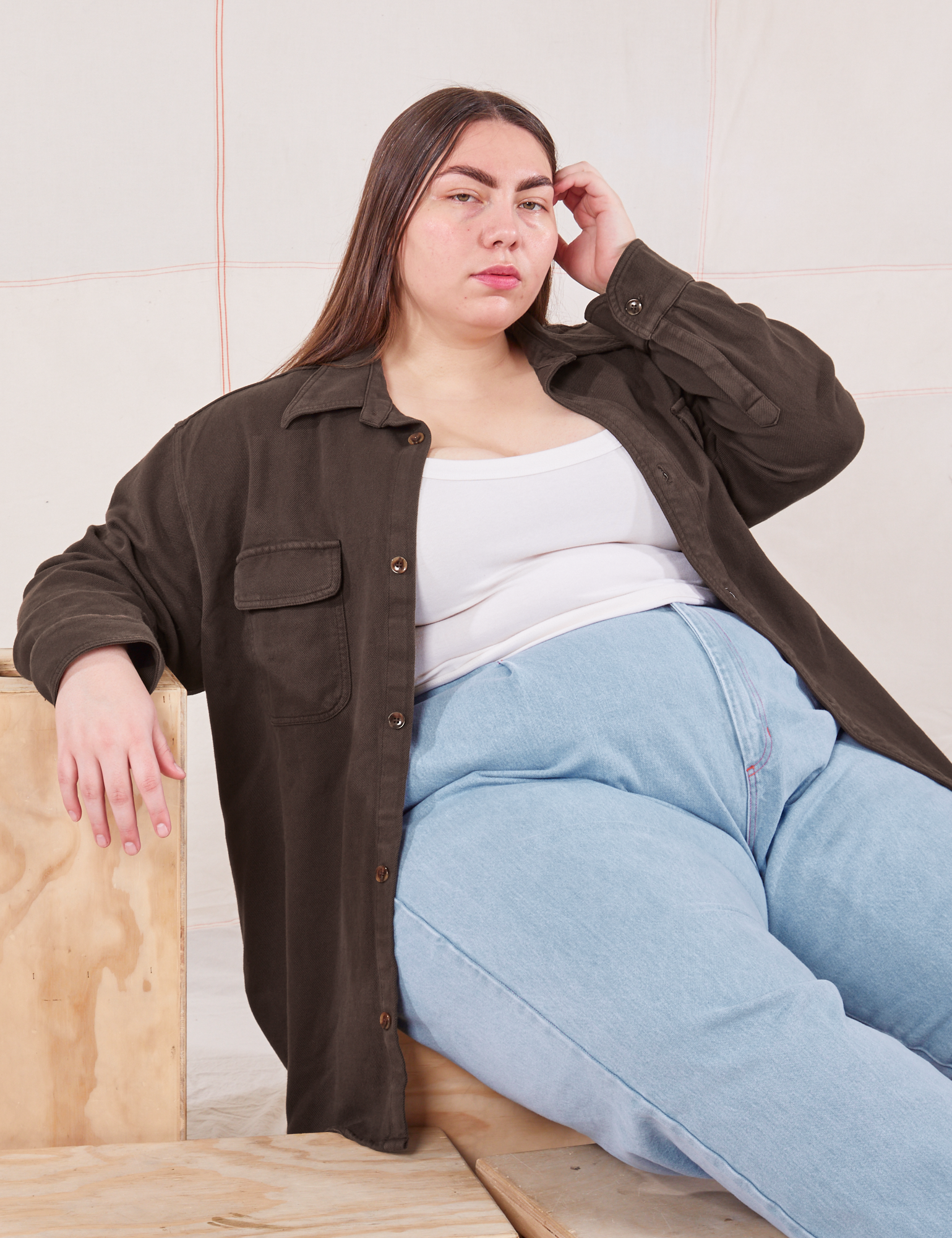 Marielena is wearing Flannel Overshirt in Espresso Brown, vintage off-white Cropped Tank Top and light wash Trouser Jeans