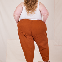 Back view of Heavyweight Trousers in Burnt Terracotta worn by Catie
