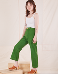 Hana is wearing Heritage Westerns in Lawn Green and Cropped Cami in vintage tee off-white