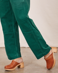 Pant leg close up of Original Overalls in Mono Hunter Green worn by Tiara