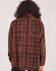 Plaid Flannel Overshirt in Fudgesicle Brown back view on Jesse