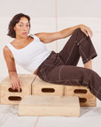 Tiara is wearing Railroad Carpenter Jeans in Fudgesicle Brown and vintage tee off-white Square Neck Tank