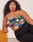 Morgan is wearing Cropped Cami in Rainbow Magic Waters and black Western Pants.