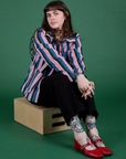 Sydney is wearing Stripe Work Jacket in Pacific Stripe and Work Pants in black