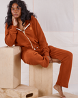 Kandia is wearing Rolled Cuff Sweat Pants in Burnt Terracotta and matching Cropped Zip Hoodies