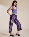 Side view of Magic Waters Drop Pocket Pants in Dark Lavender and faded grape Cropped Tank on Alex