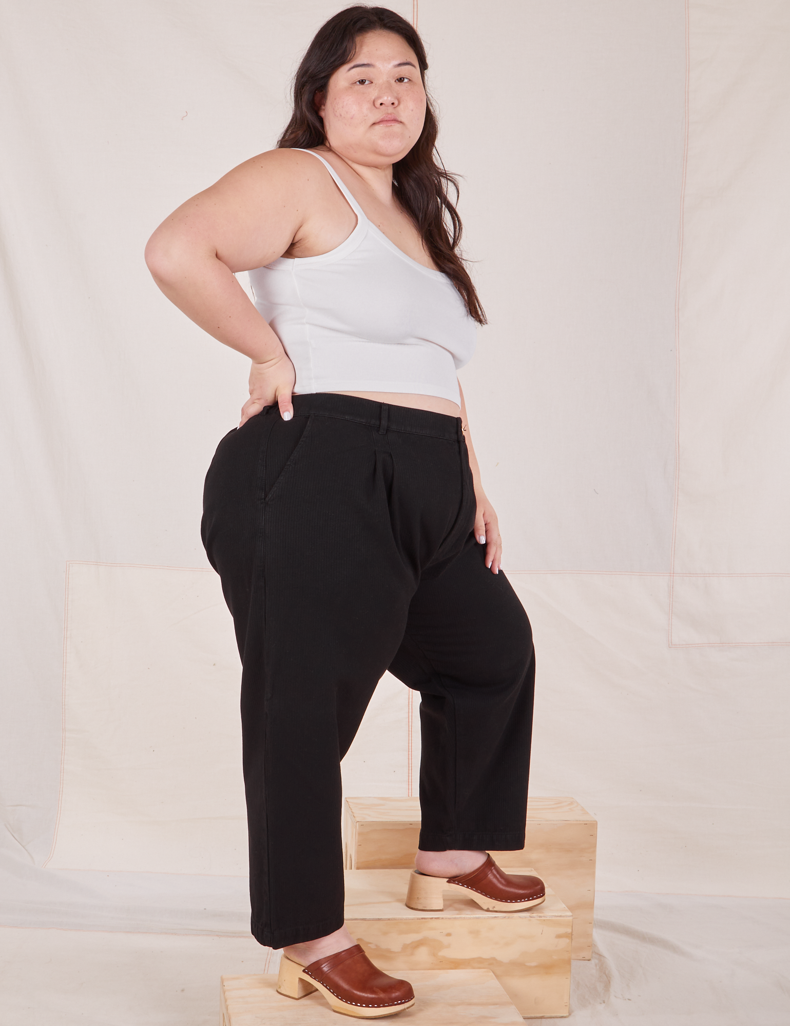 Side view of Heritage Trousers in Basic Black worn by Ashley