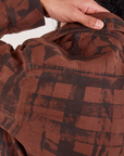 Plaid Flannel Overshirt in Fudgesicle Brown back shoulder close up on Jesse