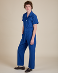 Angled front view of Short Sleeve Jumpsuit in Royal Blue on Quinn
