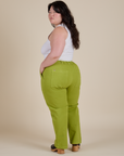 Angled back view of Work Pants in Gross Green on Ashley