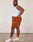 Side view of Classic Work Shorts in Burnt Terracotta and Cropped Tank Top in vintage tee off-white on Elijah