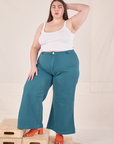 Marielena is wearing Bell Bottoms in Marine Blue and Cropped Cami in vintage tee off-white