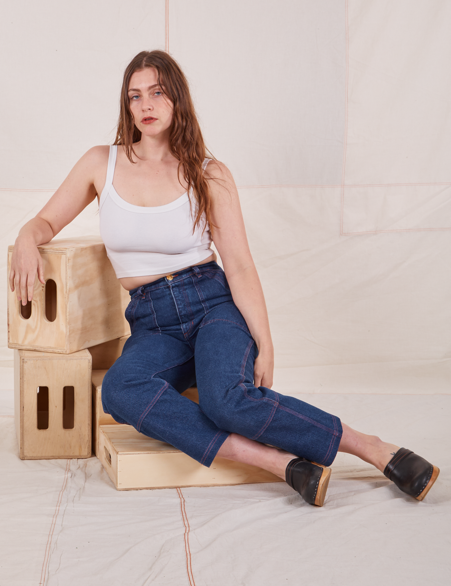 Allison is wearing Carpenter Jeans in Dark Wash and Cropped Cami in vintage tee off-white