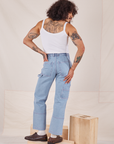 Back view of Carpenter Jeans in Light Wash and vintage off-white Cami worn by Jesse