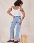 Back view of Carpenter Jeans in Light Wash and Cropped Cami in vintage tee off-white worn by Jesse