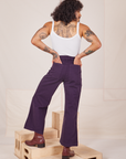 Back view of Bell Bottoms in Nebula Purple and Cropped Cami in vintage tee off-white by Jesse