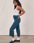 Side view of Petite Work Pants in Lagoon and vintage tee off-white Cropped Tank