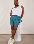 Elijah is wearing Classic Work Shorts in Marine Blue and Tank Top in vintage tee off-white