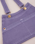 Overall Handbag in Faded Grape. White contrast stitching. Brass sun baby buttons and hardware.