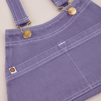 Overall Handbag in Faded Grape. White contrast stitching. Brass sun baby buttons and hardware.