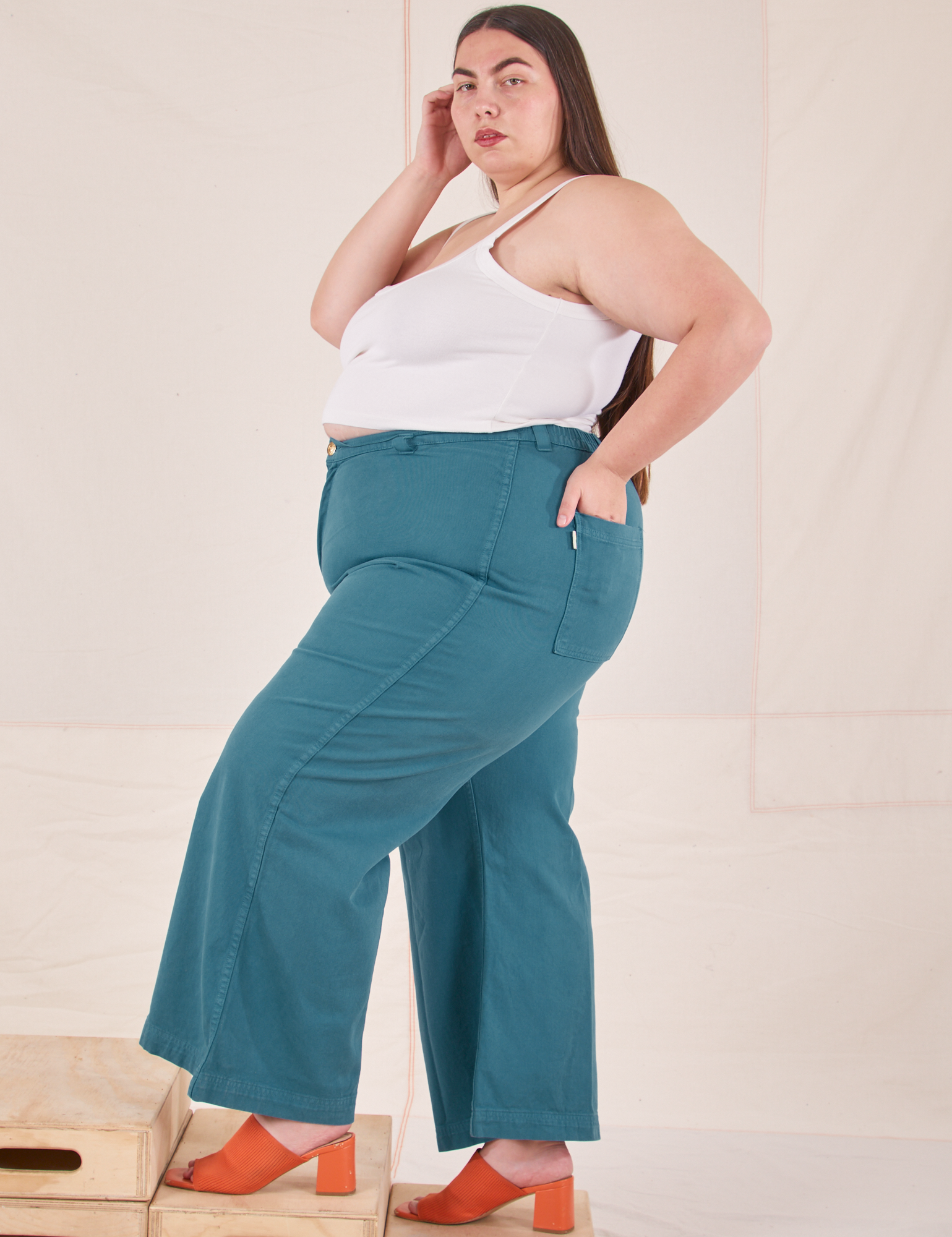 Side view of Bell Bottoms in Marine Blue and Cropped Cami in vintage tee off-white on Marielena