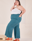 Side view of Bell Bottoms in Marine Blue and Cropped Cami in vintage tee off-white on Marielena