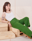 Hana is wearing Heritage Westerns in Lawn Green and Cropped Cami in vintage tee off-white