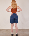 Back view of Carpenter Shorts in Dark Wash and burnt terracotta Cropped Tank on Margaret