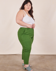 Side view of Petite Pencil Pants in Lawn Green and Cropped Cami in vintage tee off-white on Ashley