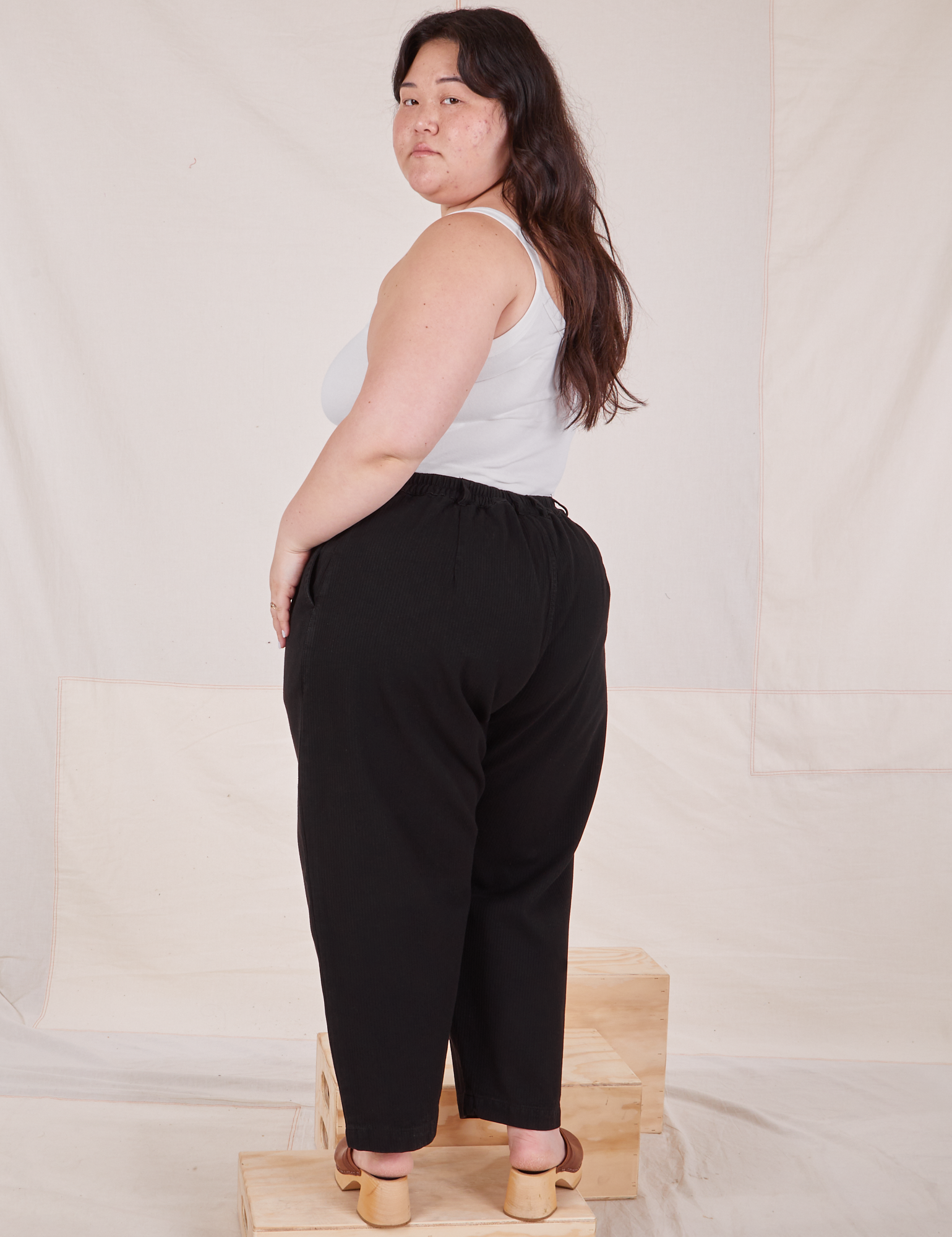 Back view of Heritage Trousers in Basic Black worn by Ashley