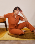 Tiara is wearing Short Sleeve Jumpsuit in Burnt Terracotta