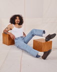 Jesse is wearing Carpenter Jeans in Light Wash and a Cropped Cami in vintage tee off-white