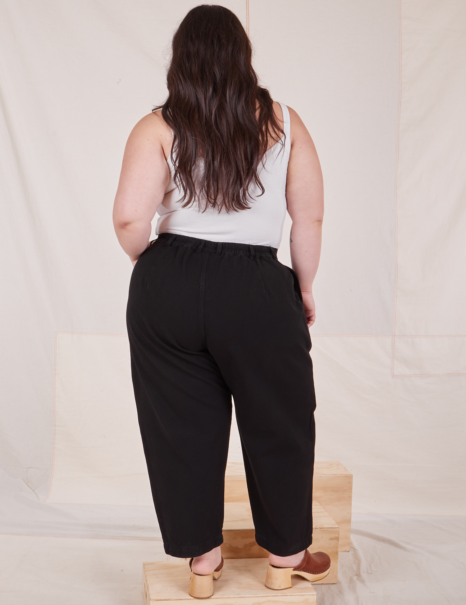 Back view of Heritage Trousers in Basic Black worn by Ashley