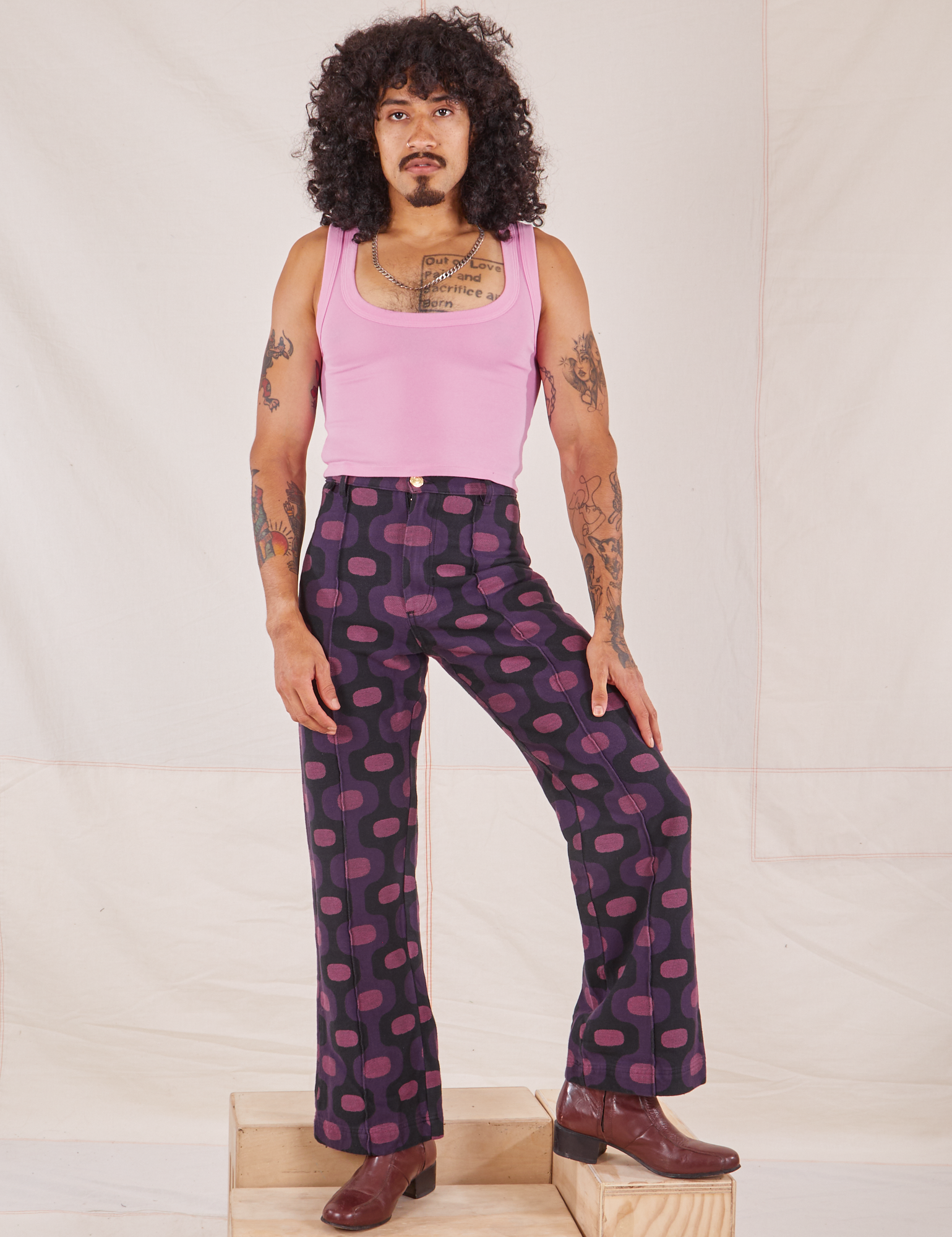 Jesse is 5&#39;8&quot; and wearing XS Western Pants in Purple Tile Jacquard paired with bubblegum pink Cropped Tank Top