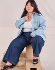 Ashley is wearing Denim Overshirt in Light Wash and dark wash Wide Leg Denim Trousers