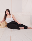 Ashley is wearing Heritage Trousers in Basic Black and vintage off-white Cropped Cami