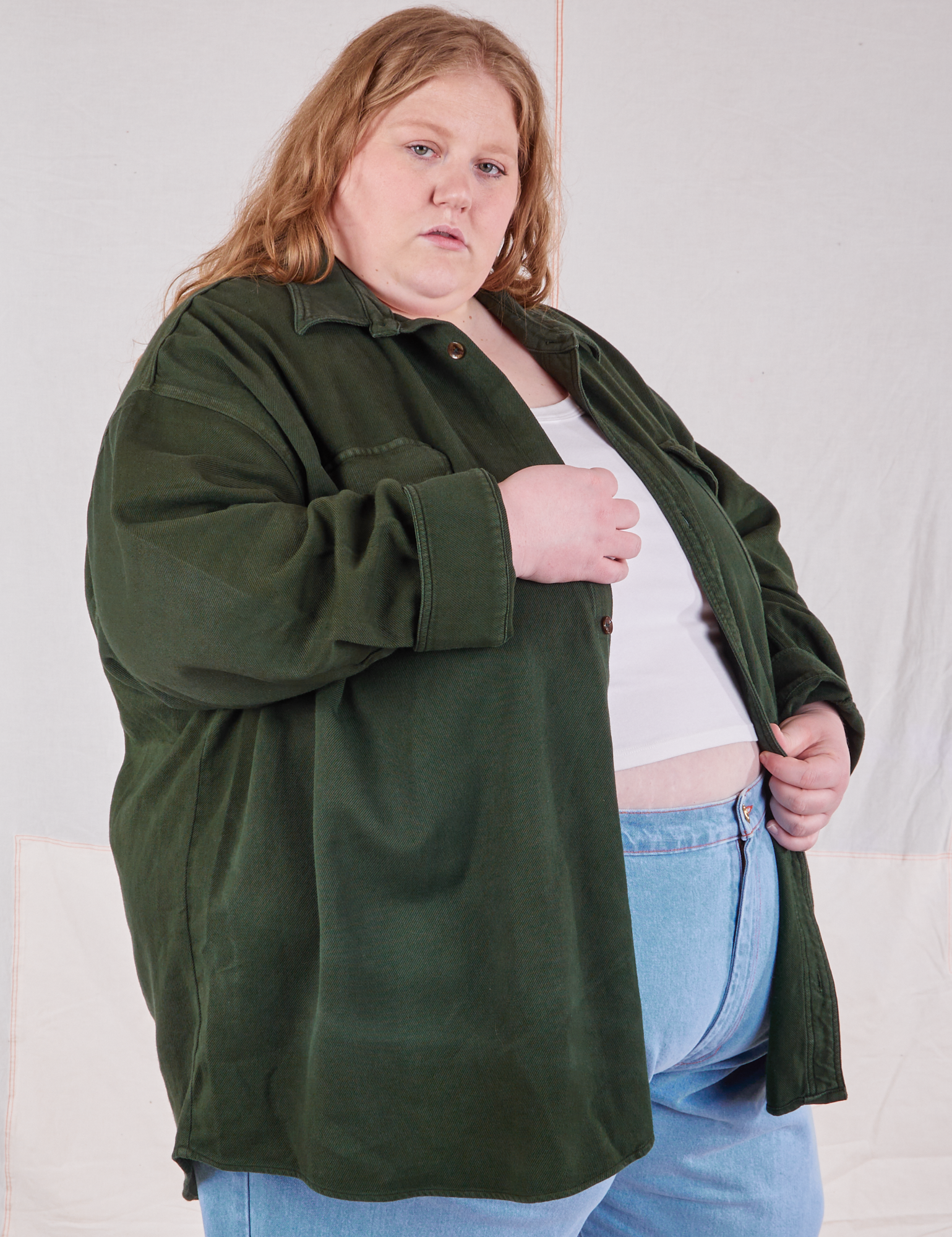 Angled front view of Flannel Overshirt in Swamp Green on Catie
