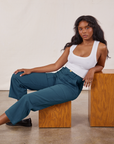 Kandia is wearing Petite Work Pants in Lagoon and vintage tee off-white Cropped Tank