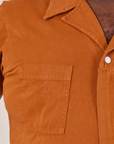 Front close up of Short Sleeve Jumpsuit in Burnt Terracotta worn by Elijah