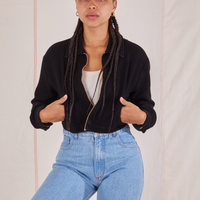 Gabi is wearing Ricky Jacket in Basic Black with both hands in the pocket