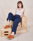 Hana is wearing Denim Trouser Jeans in Dark Wash and vintage off-white Cropped Tank Top