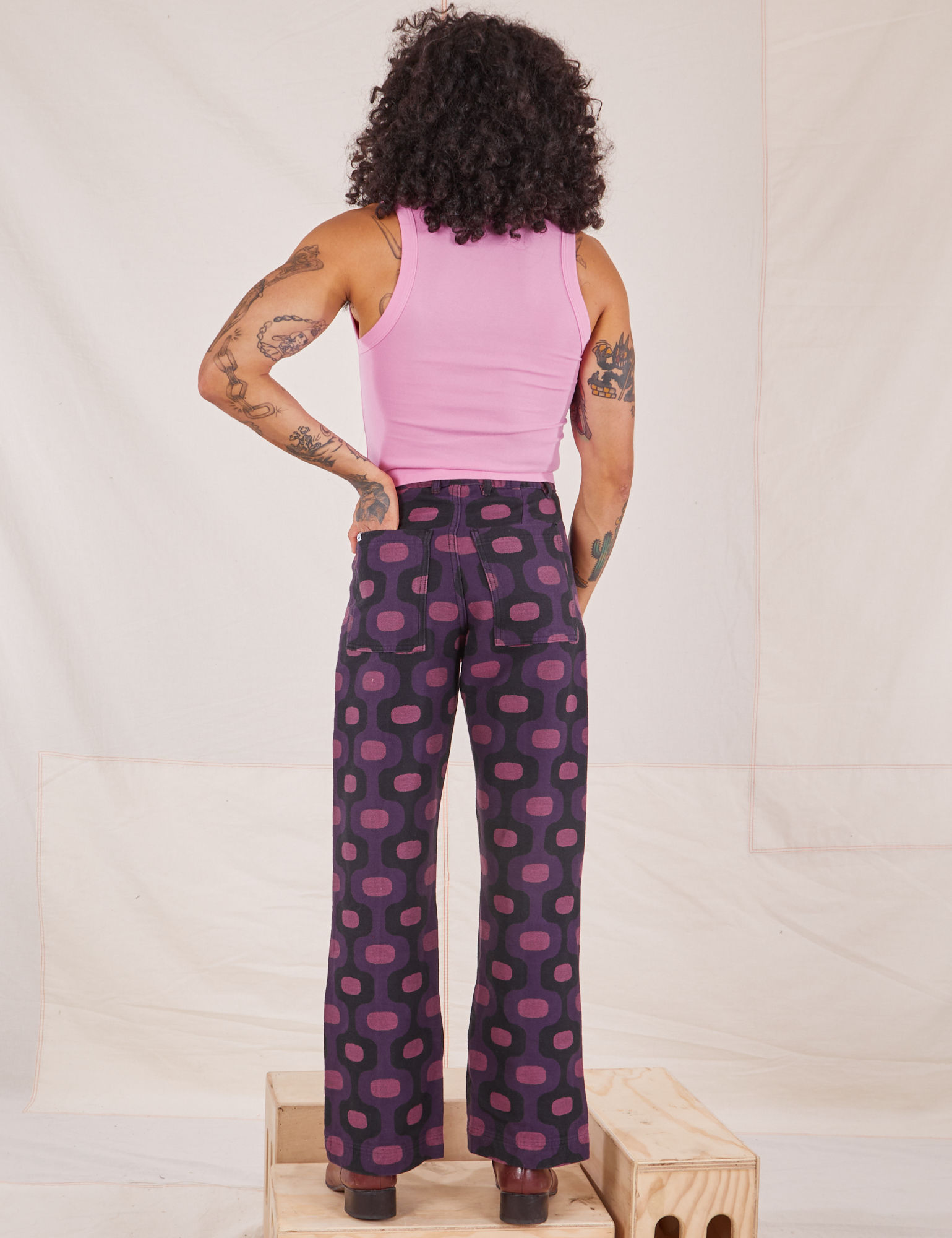 Back view of Western Pants in Purple Tile Jacquard and bubblegum pink Cropped Tank Top on Jesse
