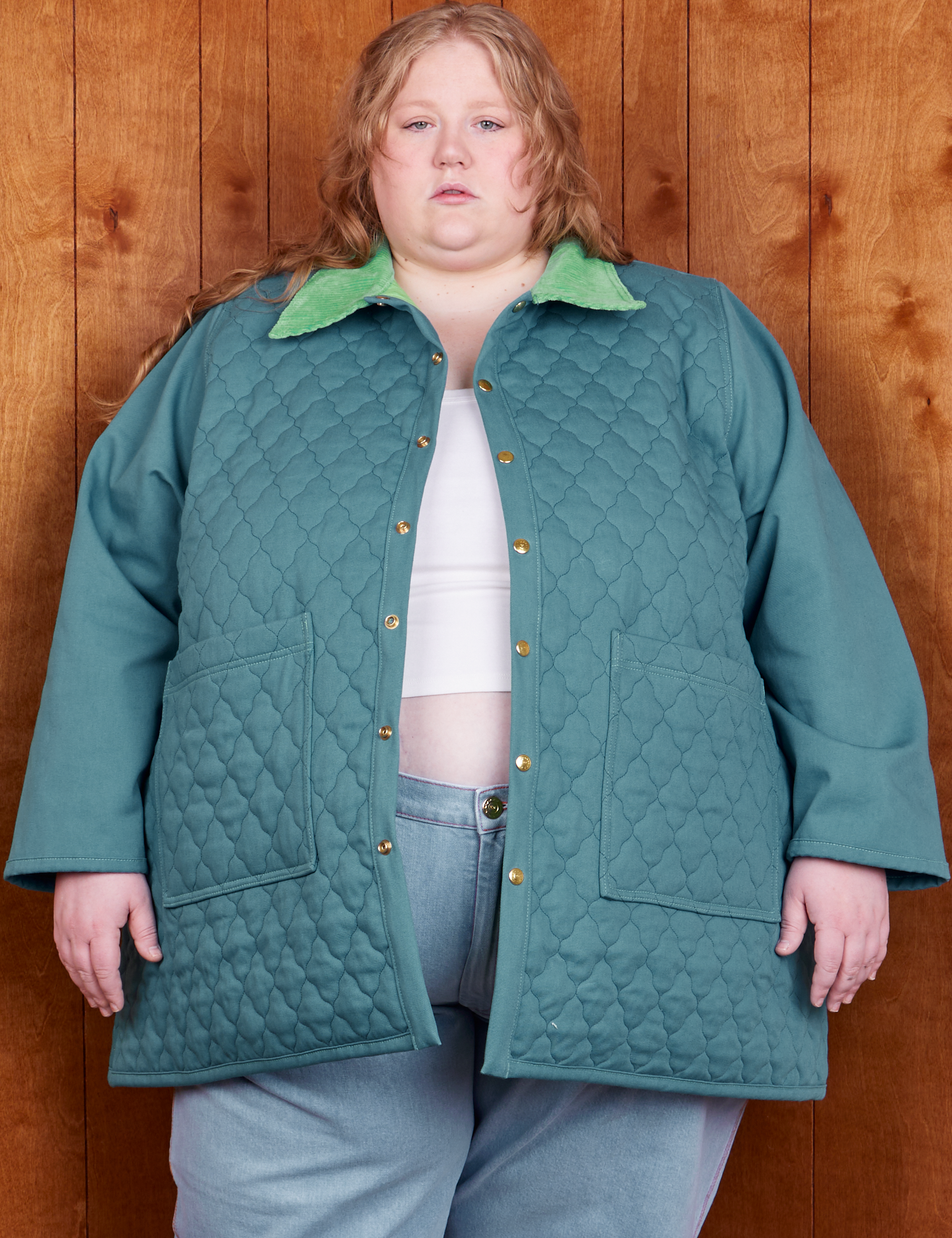 Catie is 5&#39;11&quot; and wearing 5XL Quilted Overcoat in Marine Blue