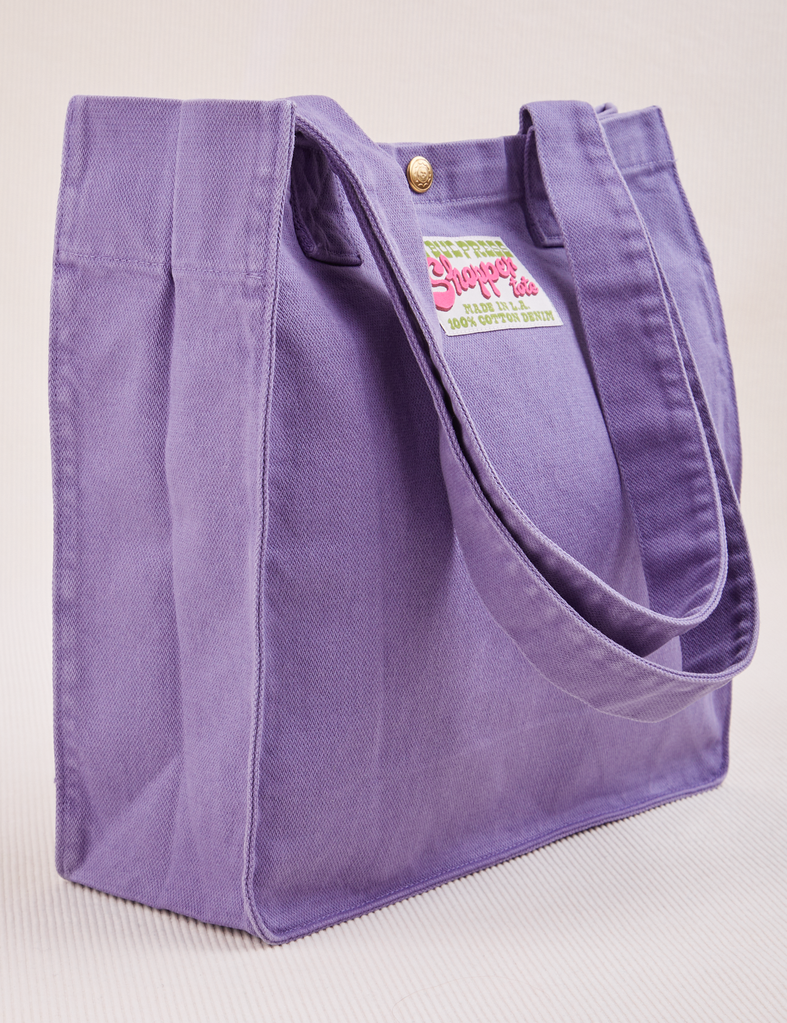 Angled view of Shopper Tote Bag in Faded Grape