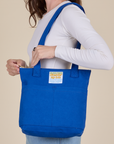 Over-Shoulder Zip Mini Tote in Royal Blue worn on shoulder of model