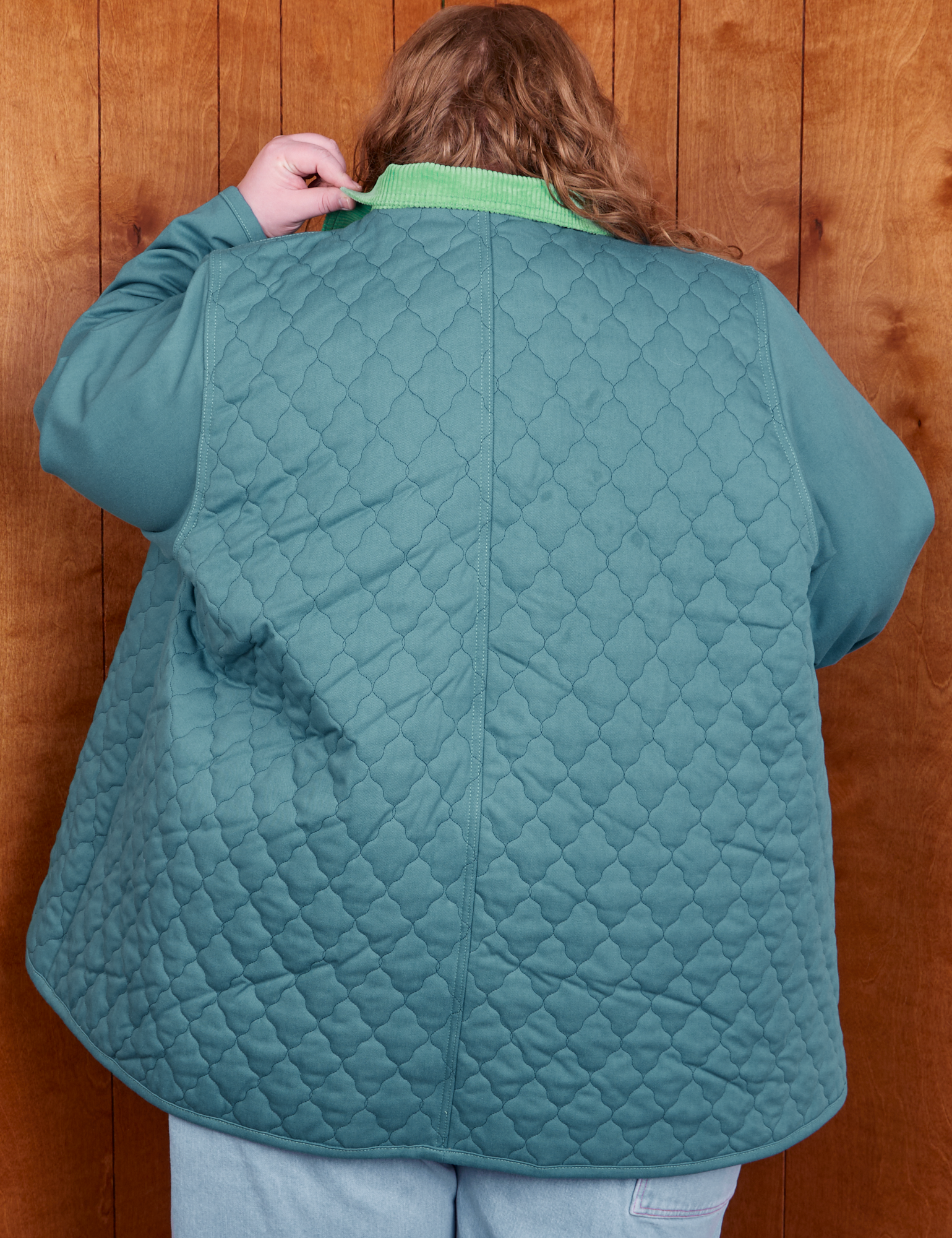 Back view of Quilted Overcoat in Marine Blue on Catie