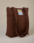 Angled view of Over-Shoulder Zip Mini Tote in Fudgesicle Brown