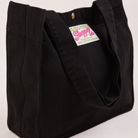 Angled view of Shopper Tote Bag in Black