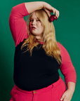 Juliet is 5'7" and wearing L Black/Pink Colorblock Raglan Tee